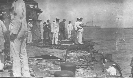 View of San Marcos (Texas), circa 1911, showing the results of target practice, most likely from the Kansas, BB 21. The officers and crew are also most probably from the Kansas