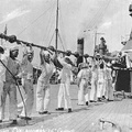 Cleaning the gun barrels on USS Oklahoma BB-37 in 1918