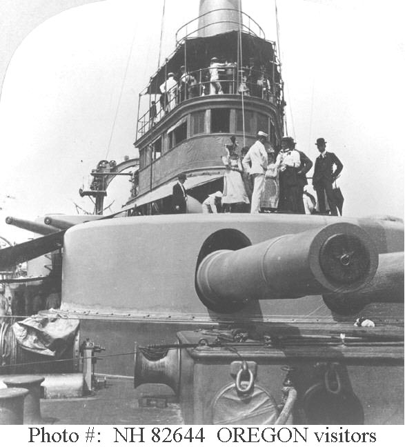 View looking aft from her forecastle, showing visitors atop her forward 13-inch gun turret, 1898. The original photograph was copyright 1898 by B.L. Singley and published on a stereograph card by the Keystone View Company.