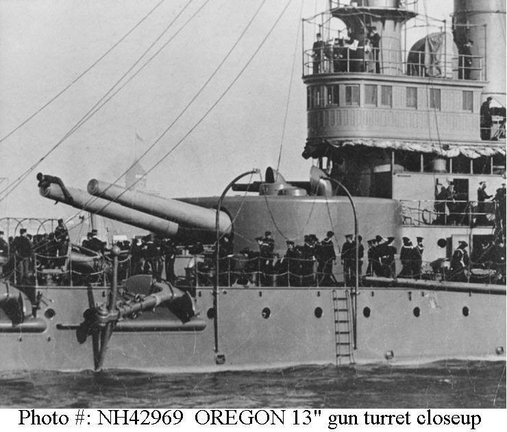 Closeup view of her forward 13-inch gun turret and pilothouse, taken as she was leaving New York for Manila, 12 October 1898. Note man atop one of the guns, and anchors stowed on &quot;billboards&quot;. This image is cropped from NH 61237.