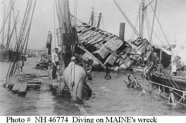 U.S. Navy diving crew at work on the ship's wreck, in 1898, seen from aft looking forward